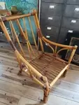 Fauteuil rotin et lanières de cuir 