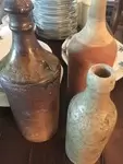 Lot de trois bouteilles 19e en terre cuite et grè 